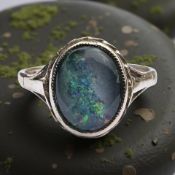 A 9ct gold opal ring, size N CONDITION REPORT: 2.