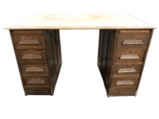 A 1930's oak twin pedestal writing desk, width 127 cm.
