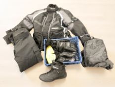 A motorcycle jacket size L, pair of trousers, gloves, etc.
