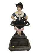 A painted cast iron figural umbrella stand in the form of a lady, height 78 cm.