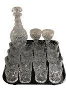 A decanter with stopper, set of twelve tumblers and several other drinking glasses.