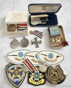 A Civil Defence Long Service medal awarded to Miss Catherine Beelie with accompanying newspaper