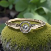 An 18ct gold and platinum diamond solitaire ring, size K CONDITION REPORT: 1.