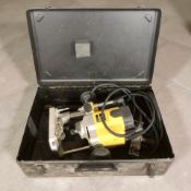 A Dewalt DW 621 router