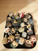 A quantity of Funko Pop figures.