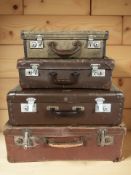 Four vintage luggage cases, largest 56 cm wide.