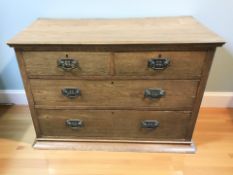 An Edwardian Art Nouveau oak five drawer chest, 107 cm x 50 cm x 77 cm.