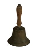 A Victorian brass school bell and a ruby glass table lustre.