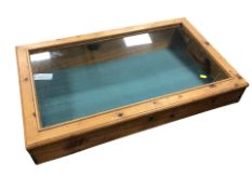 A glazed pine counter top display cabinet, width 84 cm.