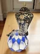 A large decorative ceramic table lamp, height 52 cm, together with a stained glass light shade.