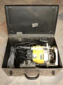 A Dewalt DW 625e router in box
