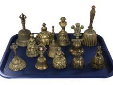 Twelve various brass bells.