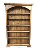 A modern pine open bookcase, 115 cm x 26 cm x 187 cm.