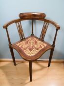 An inlaid mahogany corner armchair.