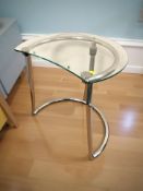 A contemporary glass and chrome lamp table,