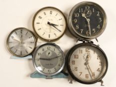 A group of vintage alarm clocks including Ingersoll, Westclox,