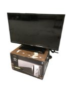 A Logik 32 inch LCD TV with lead no remote and a microwave in box
