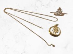 A 9ct gold rope twist chain, similar Royal Artillery brooch, and a plated St Christopher pendant.