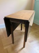 A 19th century mahogany drop leaf dining table, width 87 cm.