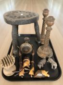 A small carved oak tripod stool and other treen including carved wooden pipes,