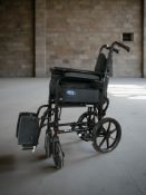 A folding wheelchair.