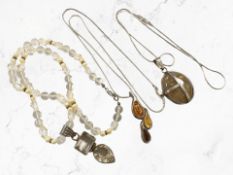 A silver and Baltic amber pendant on chain,