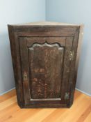 A George III oak single door corner cabinet, height 97 cm.