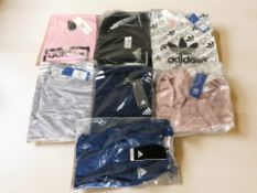A group of Adidas shirts and tops.