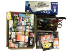 A large quantity of light bulbs, several pairs of shears,