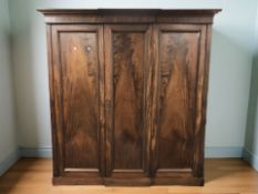 A William IV mahogany break front triple door wardrobe, 200 cm x 69 cm x 207 cm.