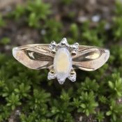 A gold opal ring, stamped 10kt, size N CONDITION REPORT: 1.