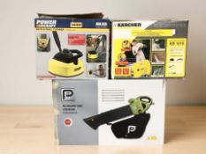 A Karcher pressure washer, together with a patio / wall cleaner and a garden vacuum, all boxed.
