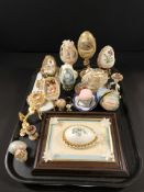 A collection of decorative egg ornaments,