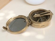 A reproduction Stanley London brass compass.