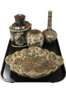 A group of Japanese export earthenware items including a scalloped edge bowl, two jars and covers,