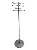 A contemporary chrome hat and coat stand.