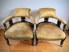 A pair of late Victorian stained beech salon armchairs.