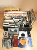 A large quantity of colour postcards, board games, small quantity of records, etc.