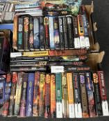 A collection of Star Wars volumes.