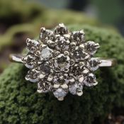 A 9ct gold cognac-diamond cluster ring, the total diamond weight approximately 1.