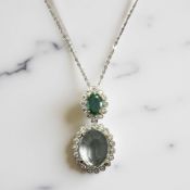 A fine 18ct white gold emerald, aquamarine and diamond pendant, pendant 2.