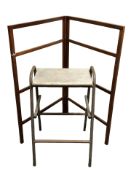 A mahogany towel rail and a metal framed stool.