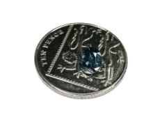 A loose brilliant-cut blue diamond, approximately 1.