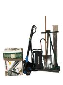 A group of garden tools including a pole hedge trimmer and Black & Decker leaf blower in box,