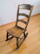 A 19th century mahogany ladder back rocking chair.