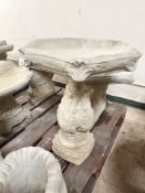 A concrete hexagonal birdbath, height 63 cm.