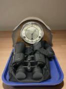 A pair of 10-30 x 60 binoculars and a Bentima oak mantel clock