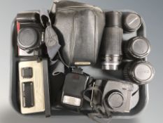 A Minox EC miniature camera in case, together with Canon EOS 1000F camera,