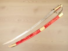 A reproduction Indian sabre in sheath.