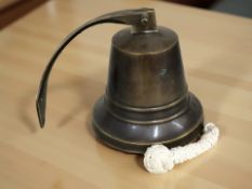 A brass ship's bell, height 15 cm.